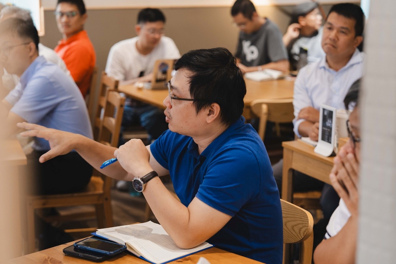 May be an image of 4 people, people studying and phone